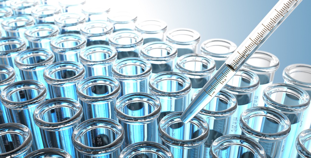 Laboratory Pipette with Blue Liquid Over Glass Test Tubes Crop Laboratory Pipette with Blue Liquid Over Glass Test Tubes Crop